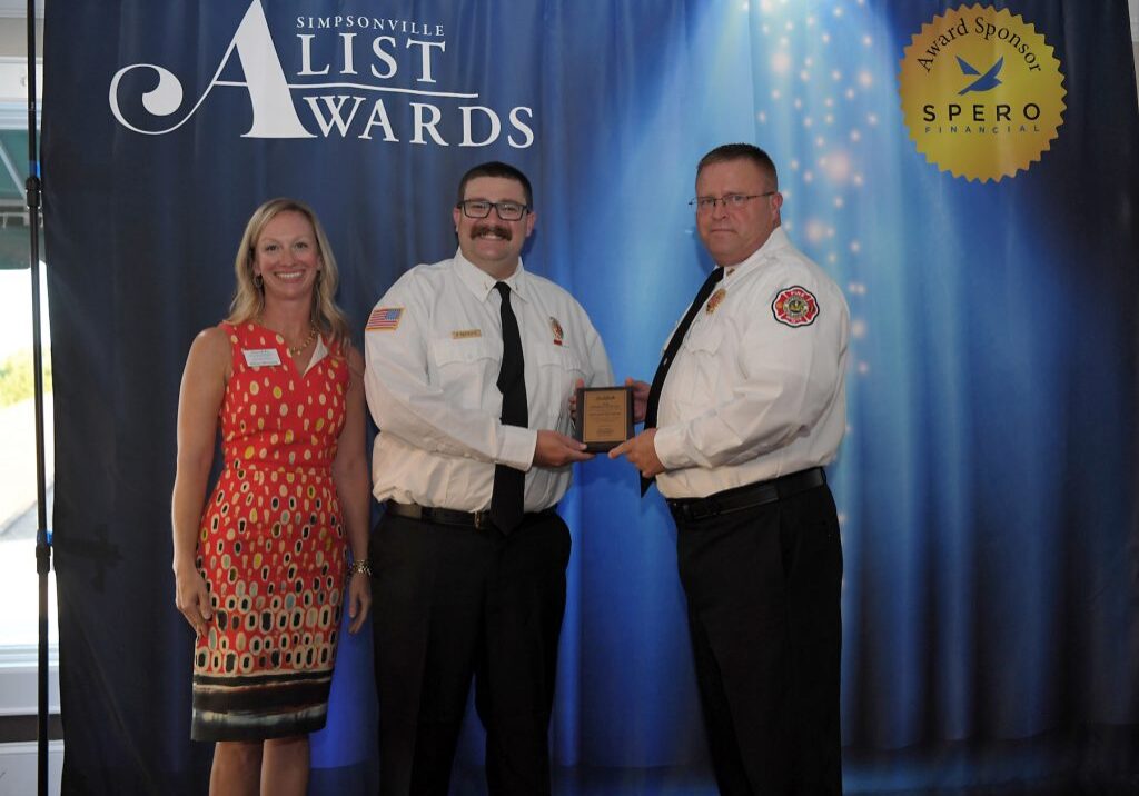 Allison McGarity, Simpsonville Firefighter of the Year Paul Patrikis and Chief Wesley Williams.